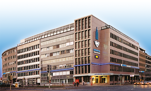 Crossing before the main building of the universa Insurance with cars on the street